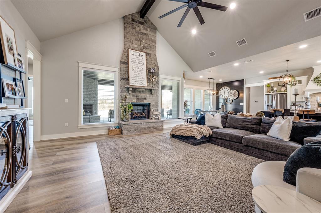 123 Proctor Lane Decatur, TX 76234 - Photo 5 of 25 a living room with furniture and a fireplace