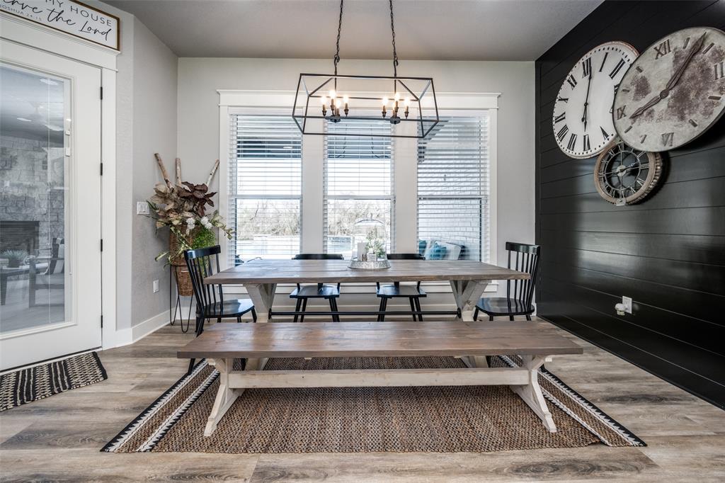 123 Proctor Lane Decatur, TX 76234 - Photo 9 of 25 a living room with furniture a chandelier and a table