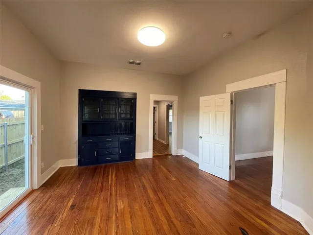 a kitchen with granite countertop a refrigerator and a sink
