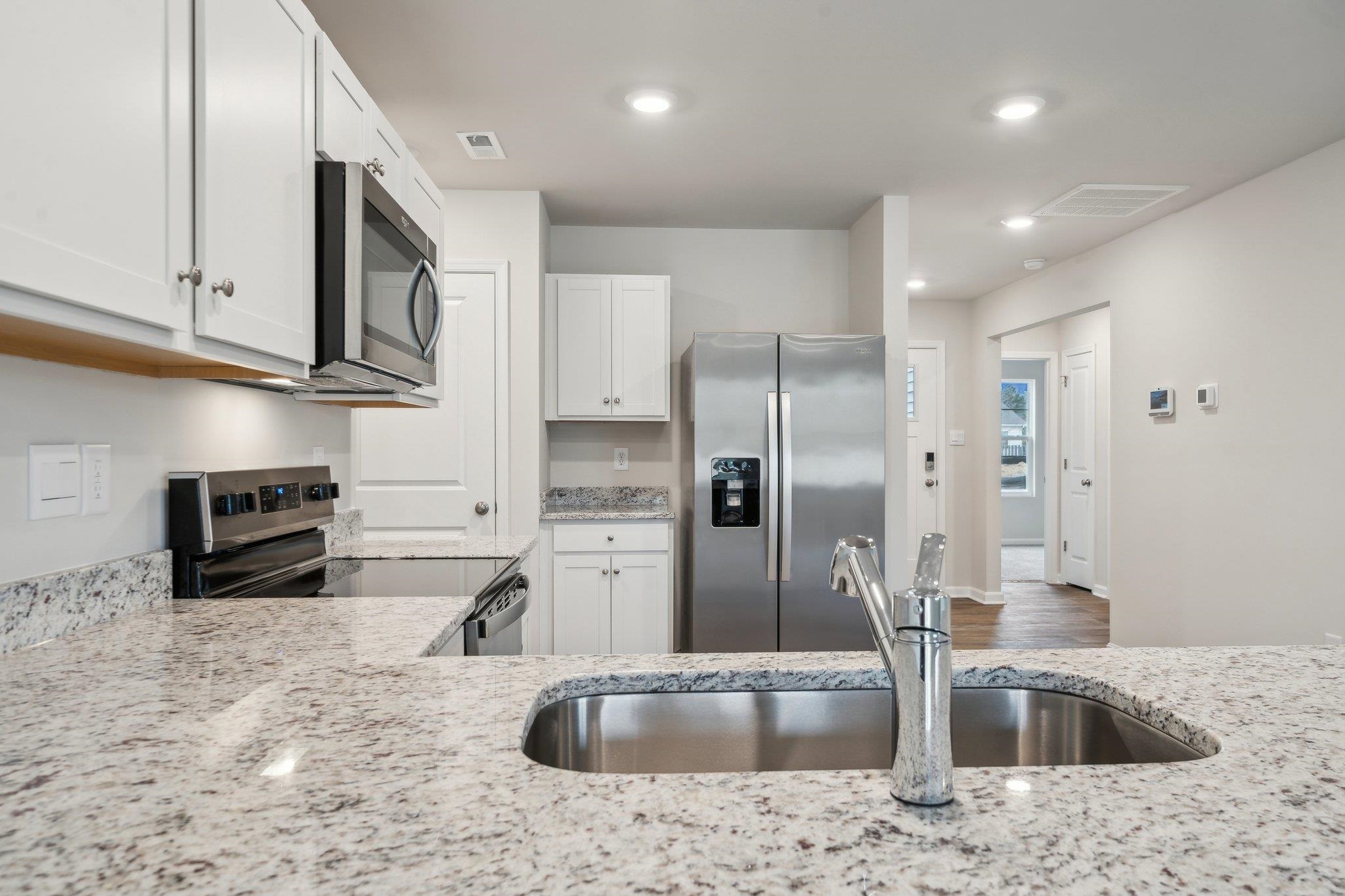 105 Fieldcrest Lane Staunton, VA 24401 - Photo 12 of 33 a kitchen with stainless steel appliances granite countertop a sink a refrigerator and a granite counter tops