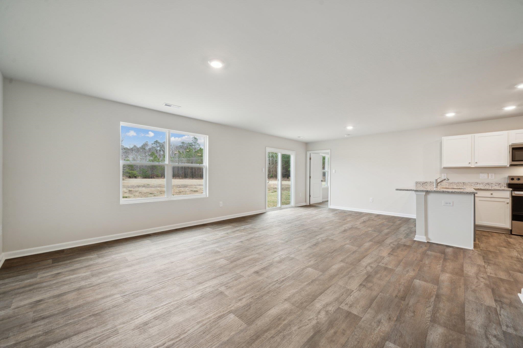 105 Fieldcrest Lane Staunton, VA 24401 - Photo 16 of 33 a view of an empty room with wooden floor and a window