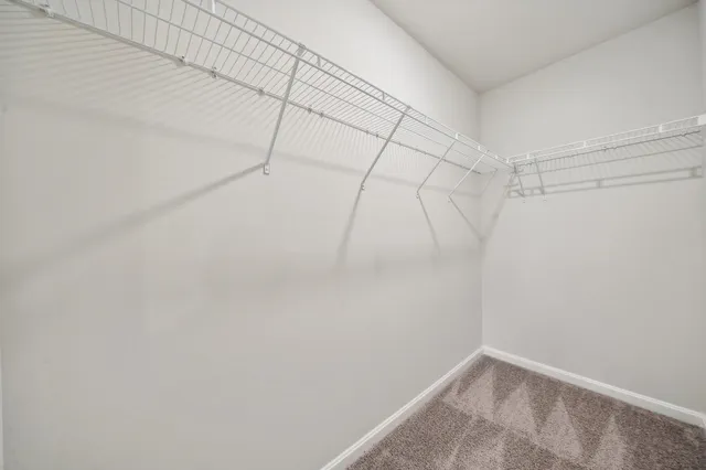 a yellow house with trees in front of it