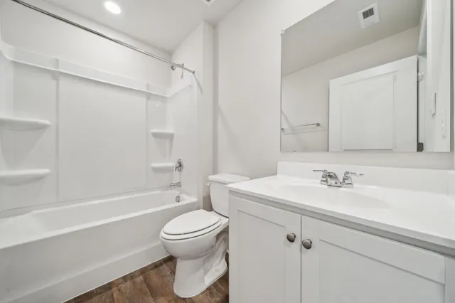 a bathroom with a sink a toilet and a bathtub