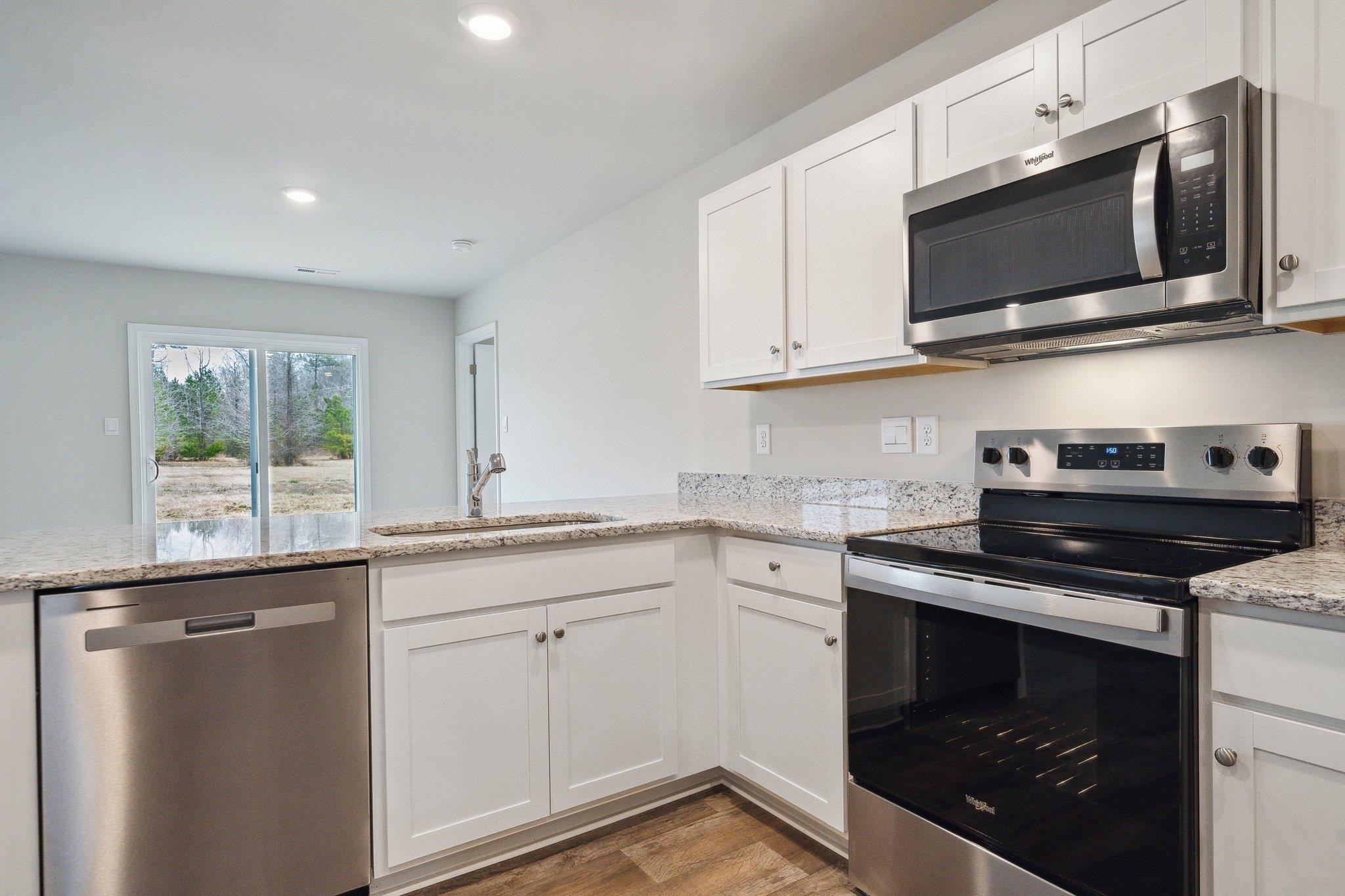 105 Fieldcrest Lane Staunton, VA 24401 - Photo 31 of 33 a kitchen with stainless steel appliances granite countertop a sink and a stove top oven