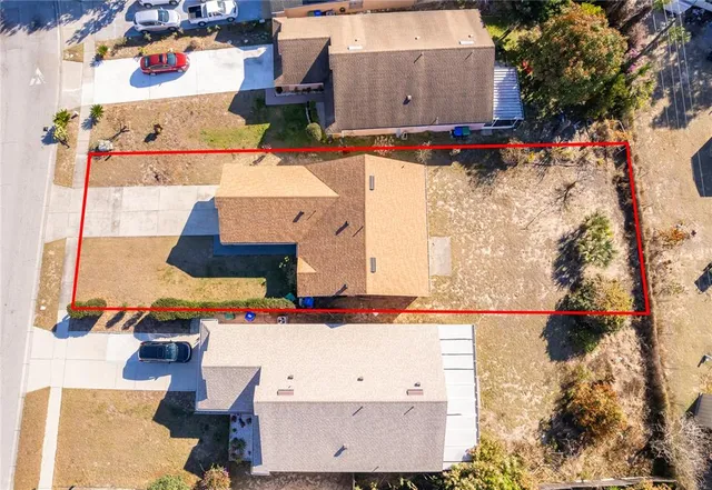 an aerial view of residential houses with outdoor space