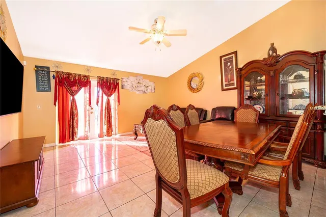 a dining room with furniture and window