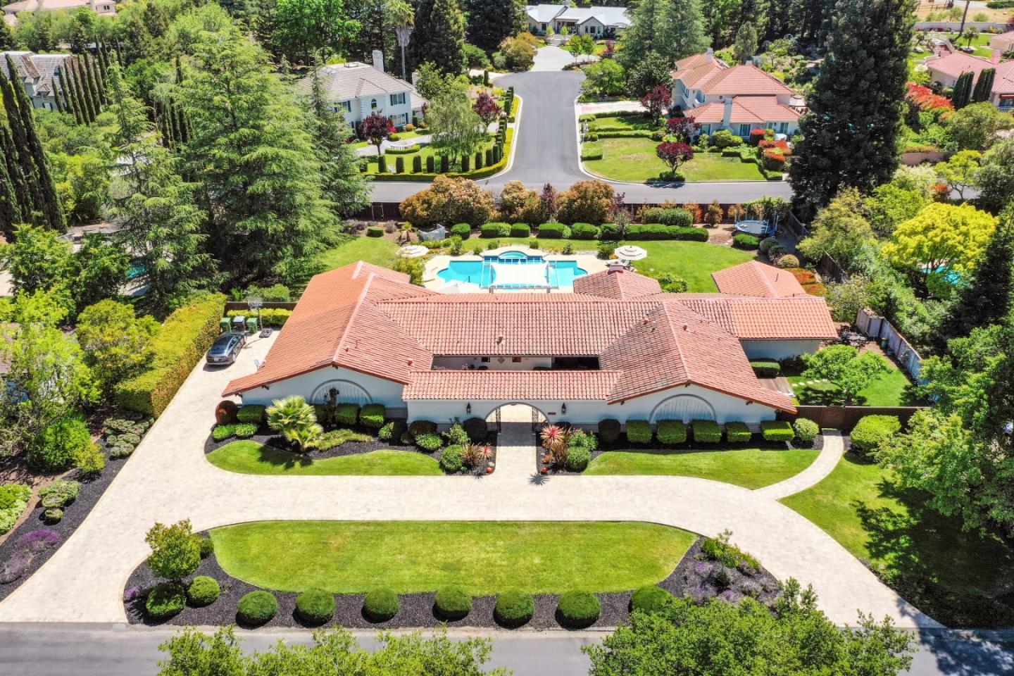 15162 Alma Jo Court Monte Sereno, CA 95030 - Photo 2 of 4 an aerial view of a house with a garden and lake view