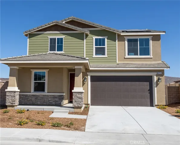 a front view of a house with yard