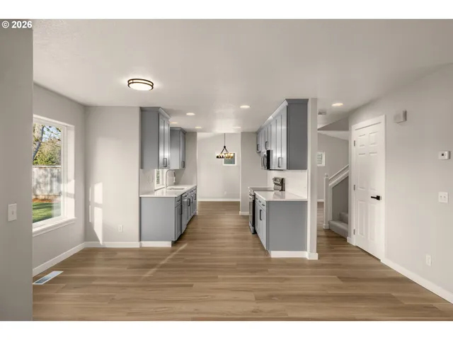 a view of kitchen with kitchen island refrigerator sink and stove