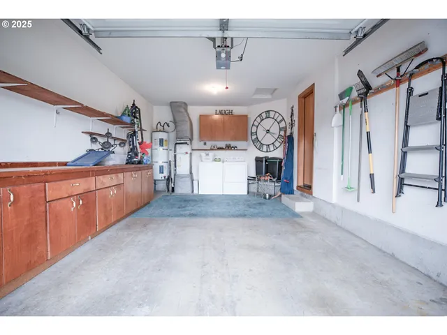 a open kitchen with cabinets and wooden floor