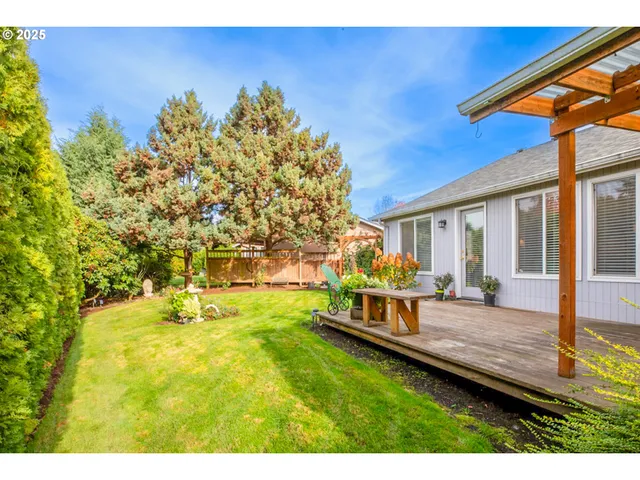 a view of a house with backyard porch and sitting area