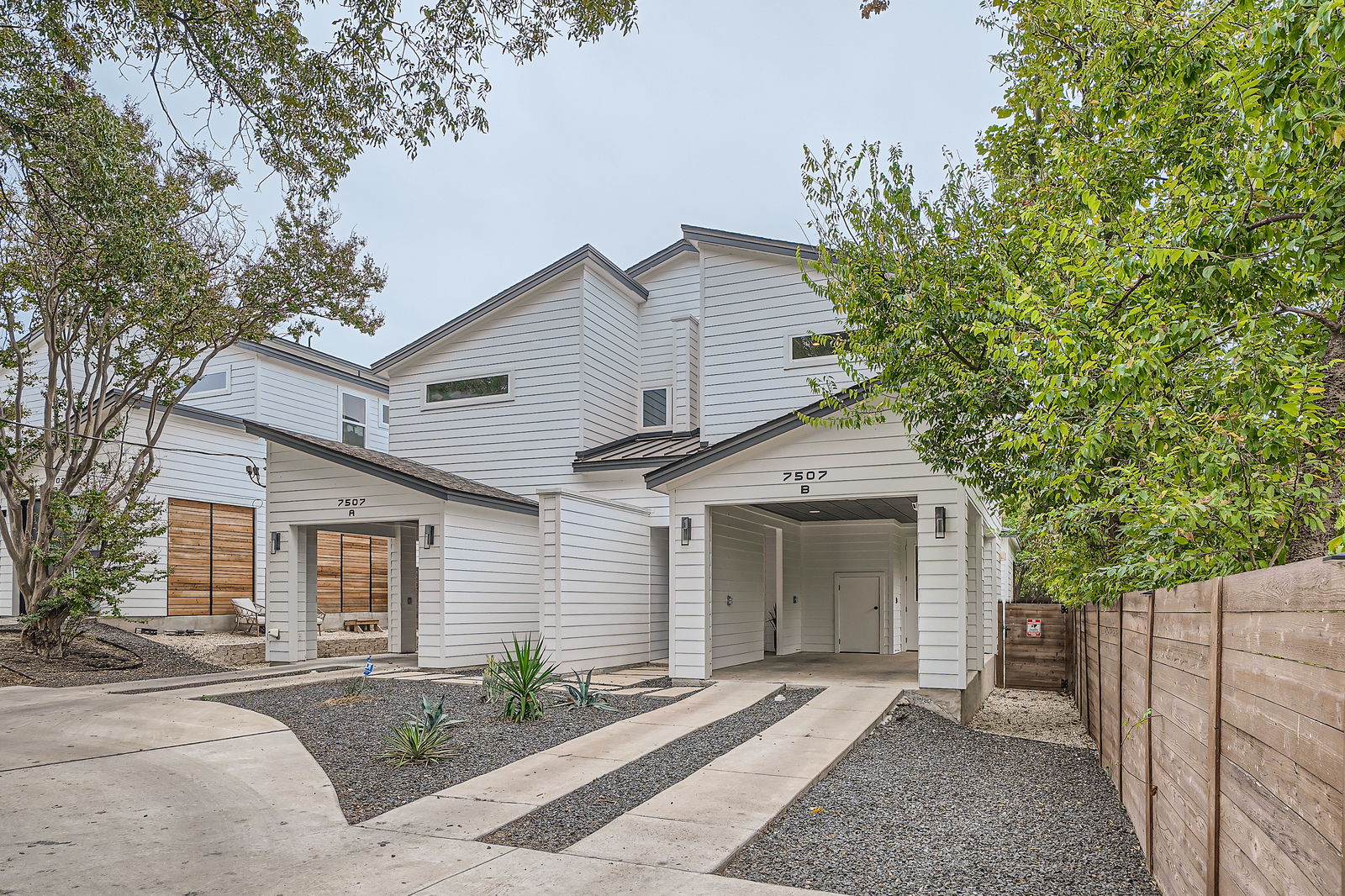 7507 Bethune Avenue, Unit B Austin, TX 78752 - Photo 2 of 23 Privacy fence with gate to rear yard. Carport with extra storage.