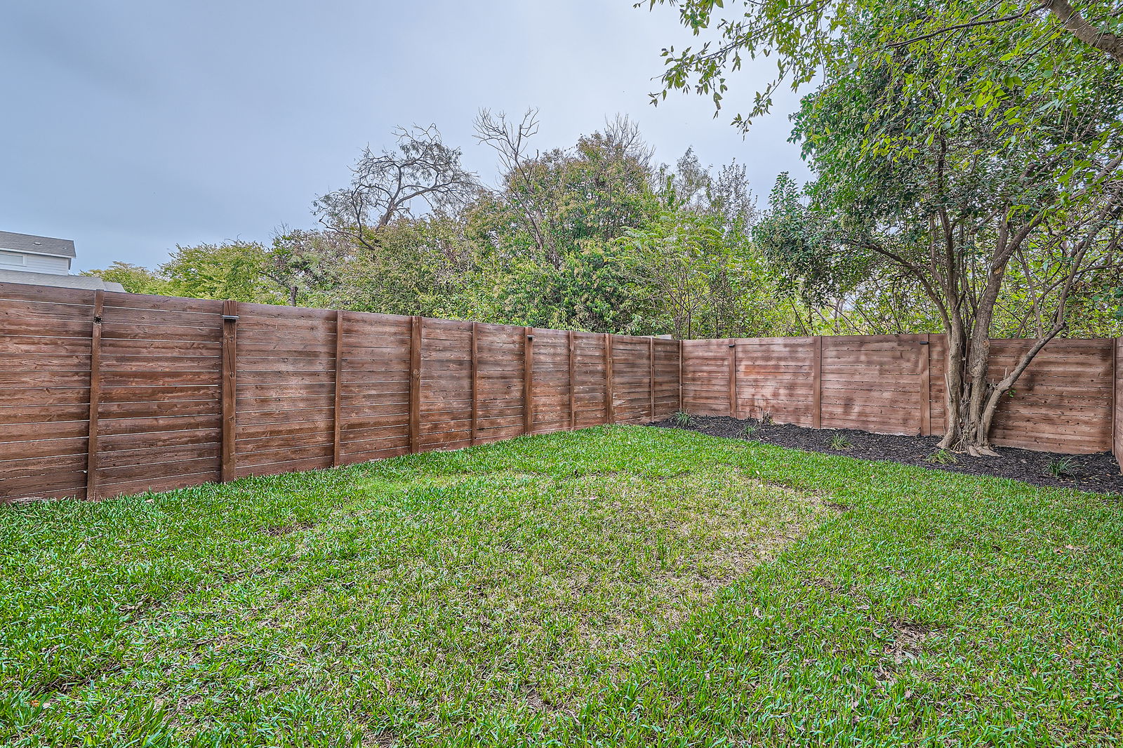 7507 Bethune Avenue, Unit B Austin, TX 78752 - Photo 21 of 23 View of the large yard featuring a fenced backyard.