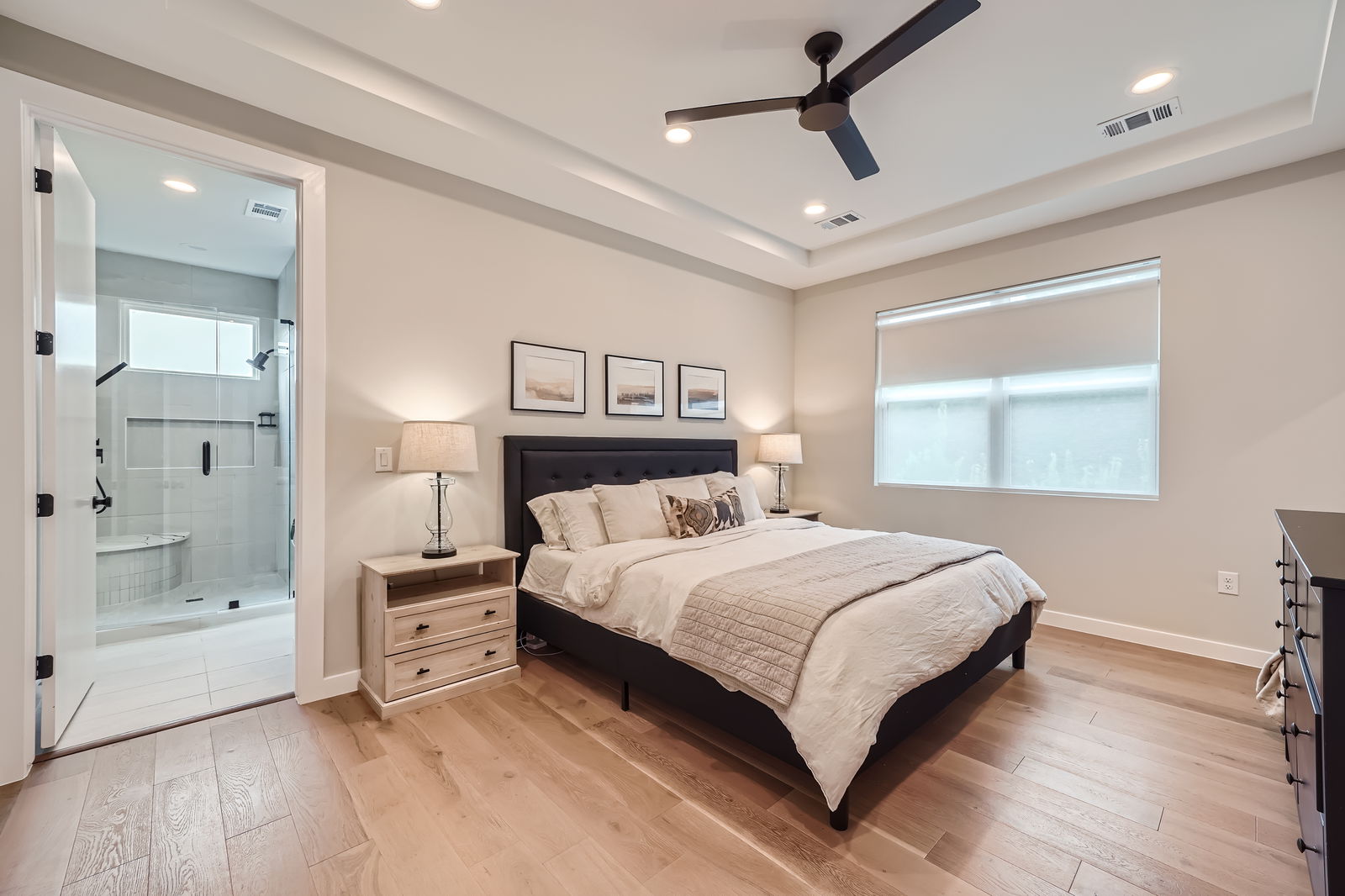 7507 Bethune Avenue, Unit B Austin, TX 78752 - Photo 10 of 23 Spacious primary bedroom with gorgeous wood flooring.