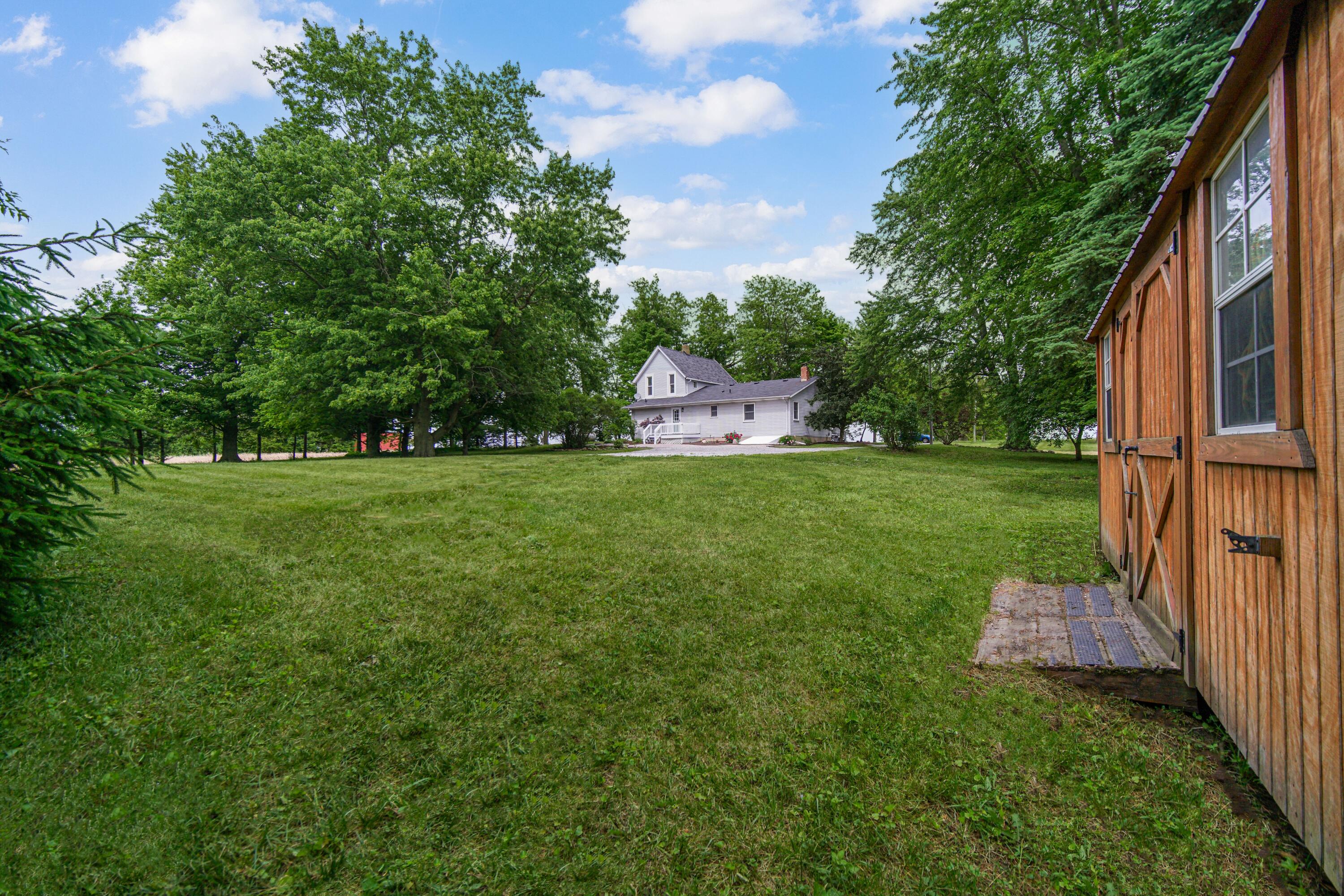 476 Highway 2 Hebron, IN 46341 - Photo 24 of 25 a backyard of a house with lots of green space