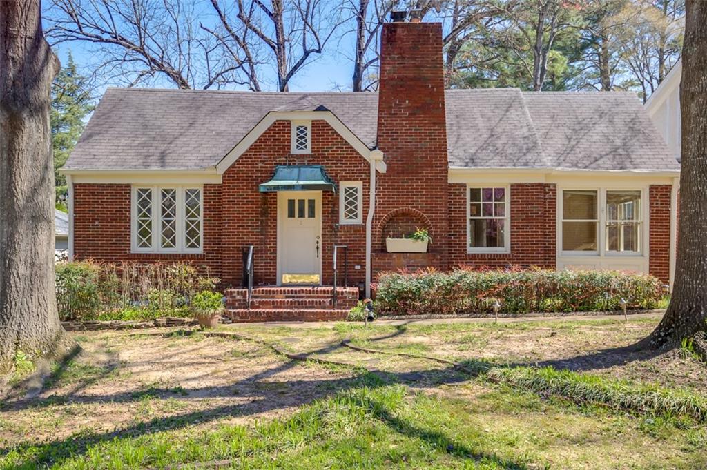 1926 classic bungalow with Tudor influence including diamond pattern windows on flat one-third acre lot.Entry level price to live in verdant prized Druid Hills 