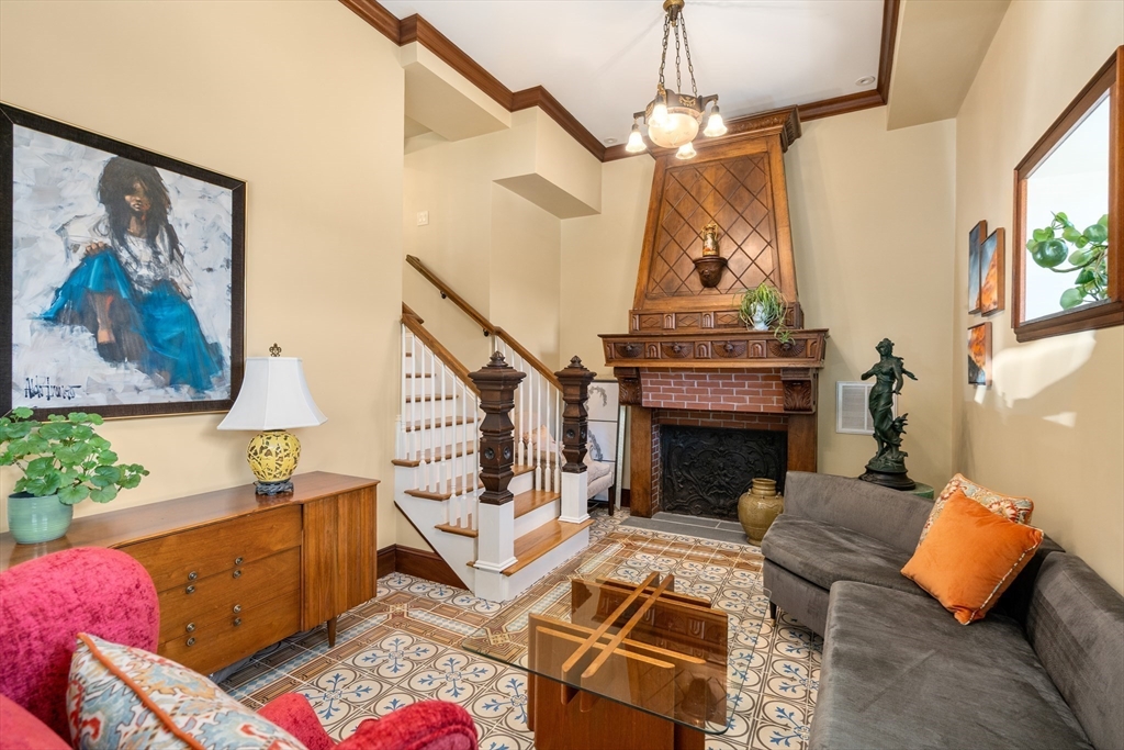 63 Crabtree Road Quincy, MA 02171 - Photo 12 of 41 a living room with furniture a fireplace and a flat screen tv