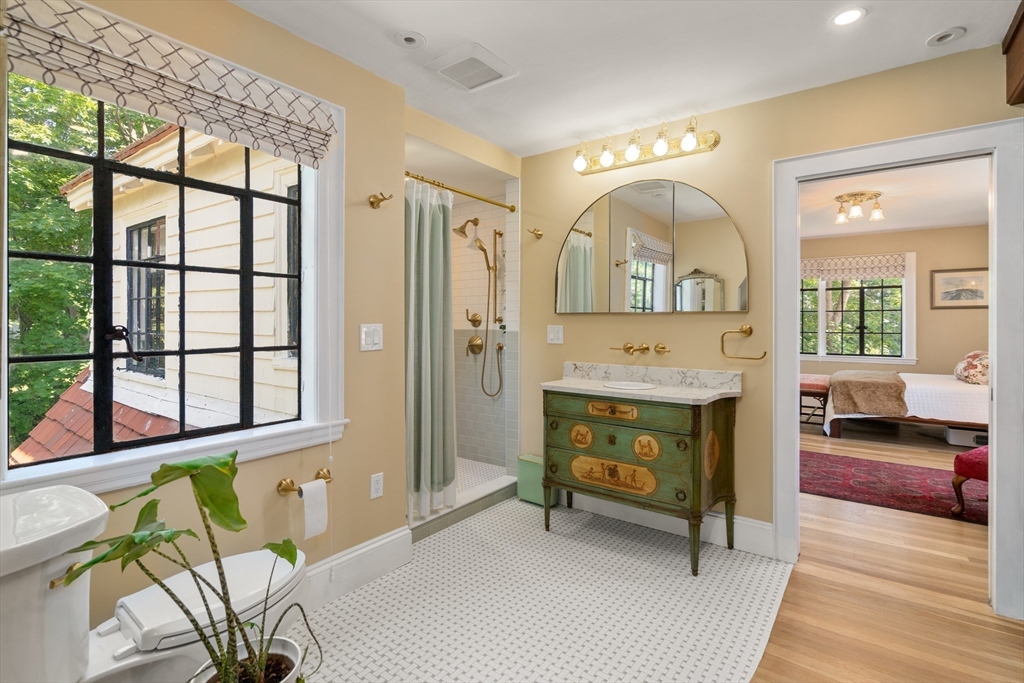 63 Crabtree Road Quincy, MA 02171 - Photo 23 of 41 a living room with furniture a fireplace and a floor to ceiling window