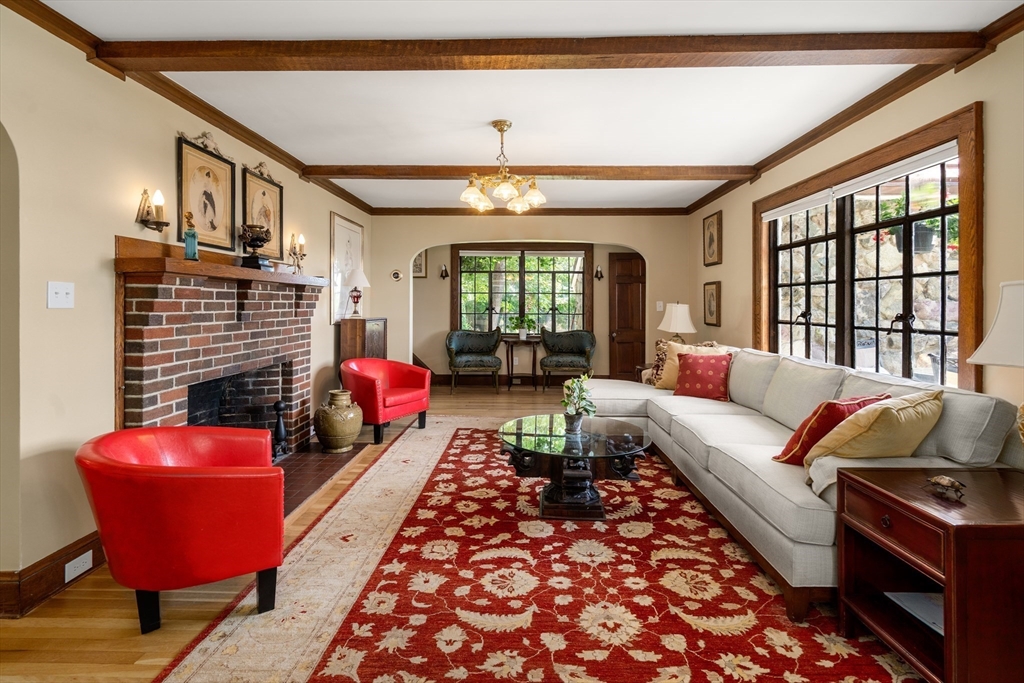 63 Crabtree Road Quincy, MA 02171 - Photo 4 of 41 a living room with furniture a rug and a chandelier