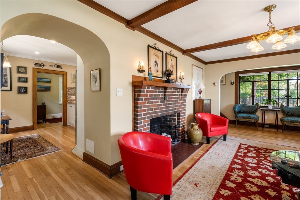 63 Crabtree Road Quincy, MA 02171 - Photo 7 of 41 a living room with furniture fireplace and a table