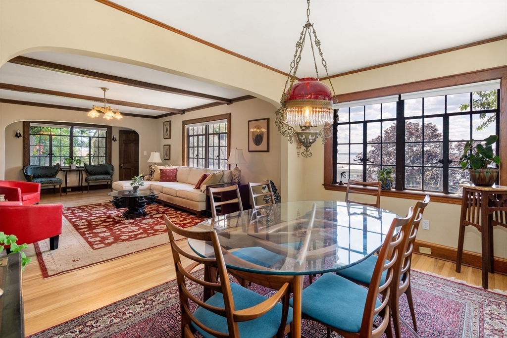 63 Crabtree Road Quincy, MA 02171 - Photo 9 of 41 a dining room with furniture a chandelier and wooden floor