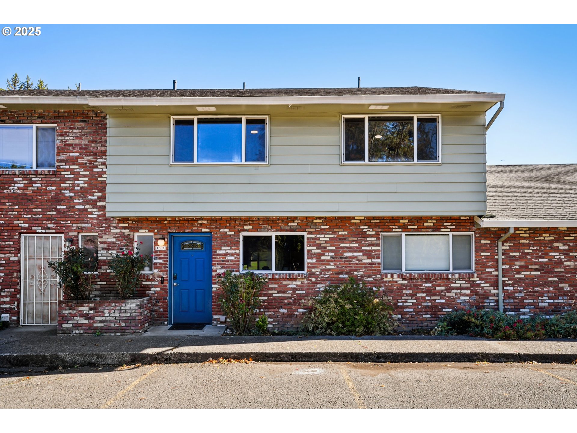 1302 Northeast Hogan Drive, Unit 169 Gresham, OR 97030 - Photo 1 of 46 a front view of a house with garage