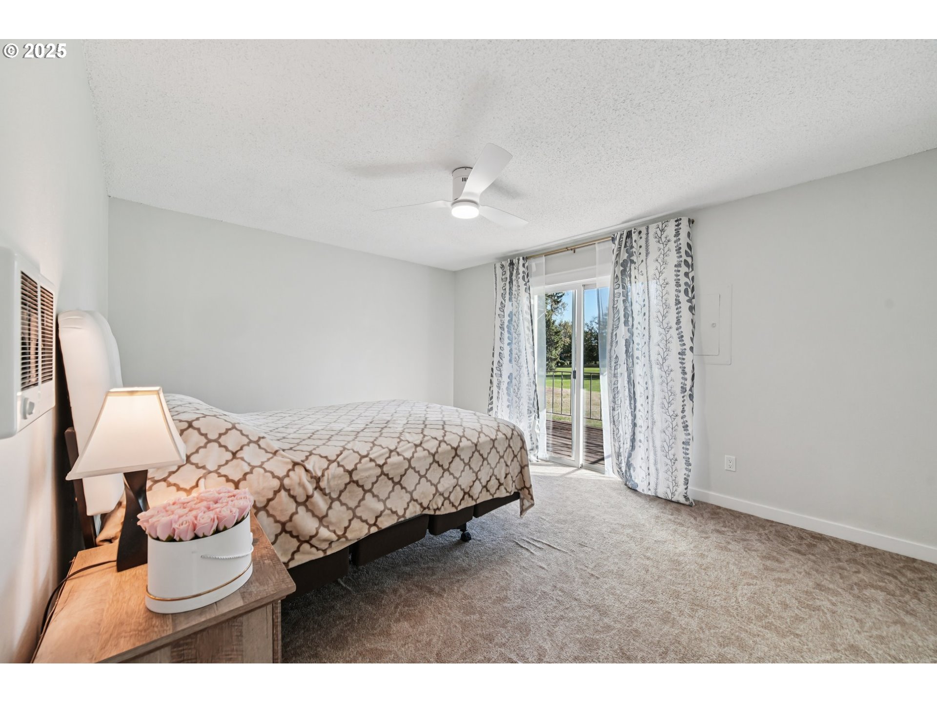 1302 Northeast Hogan Drive, Unit 169 Gresham, OR 97030 - Photo 29 of 46 a bedroom with a bed and a window