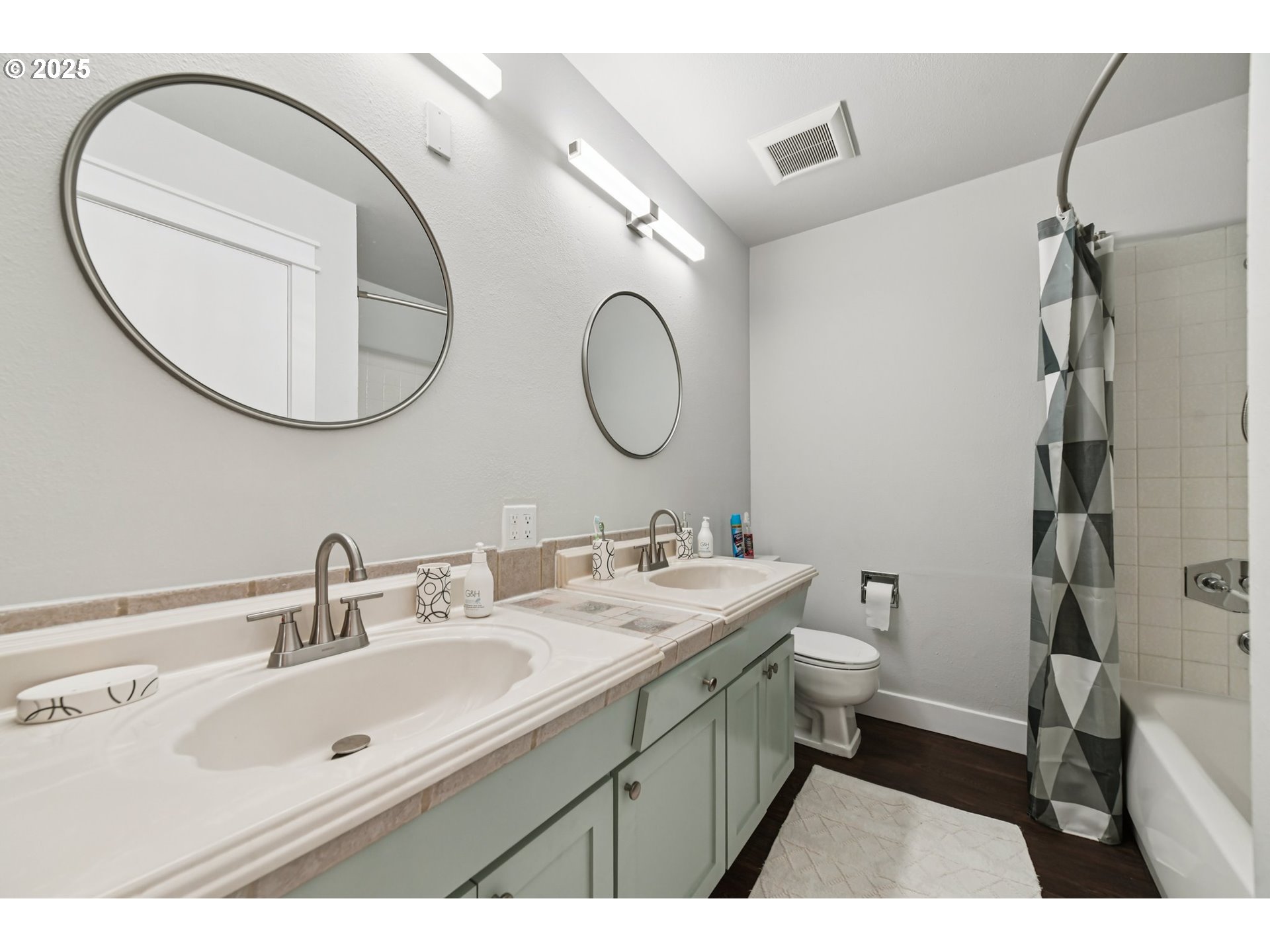 1302 Northeast Hogan Drive, Unit 169 Gresham, OR 97030 - Photo 33 of 46 a bathroom with a double vanity sink mirror and toilet