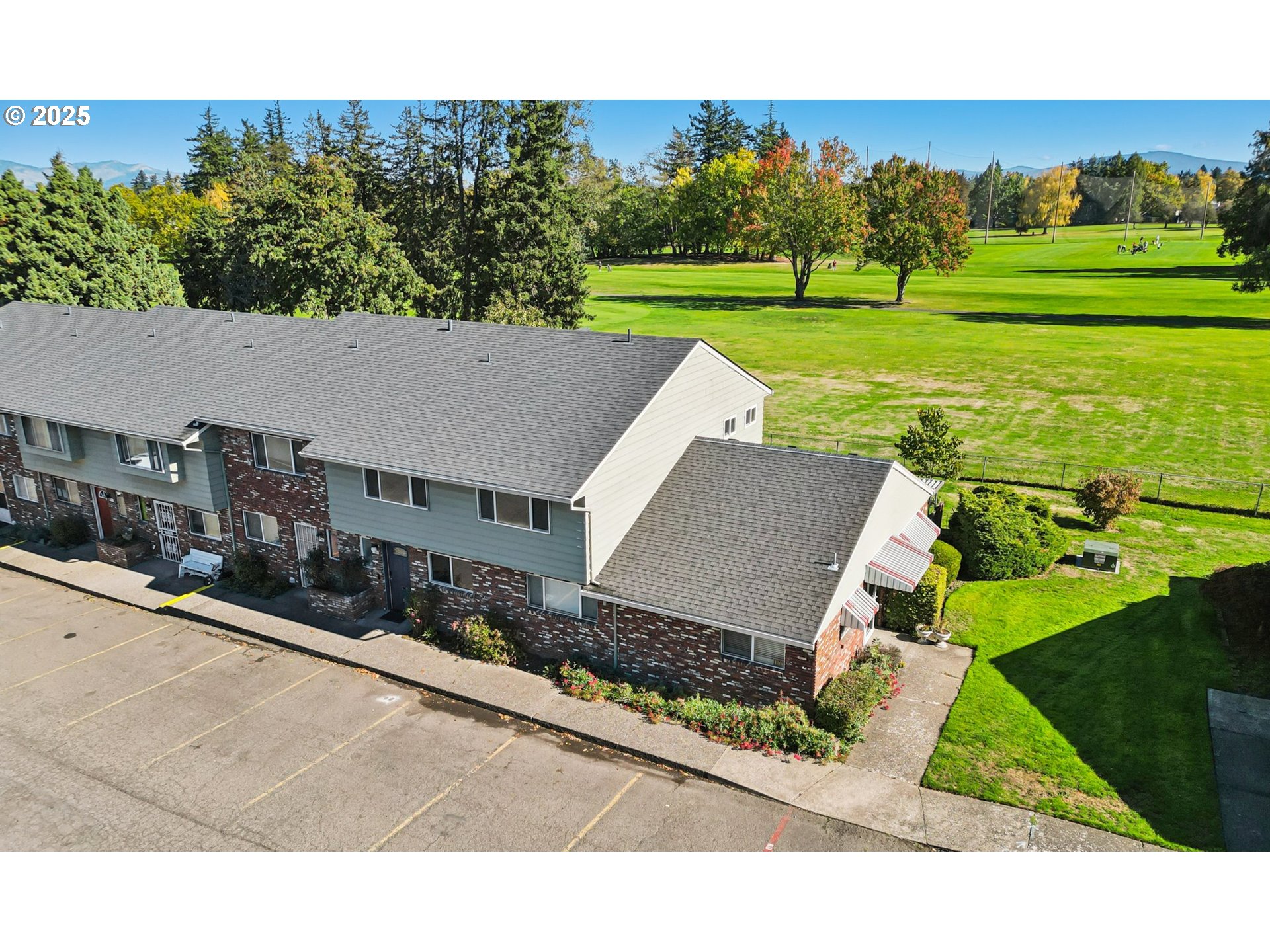 1302 Northeast Hogan Drive, Unit 169 Gresham, OR 97030 - Photo 37 of 46 a view of a house with a big yard