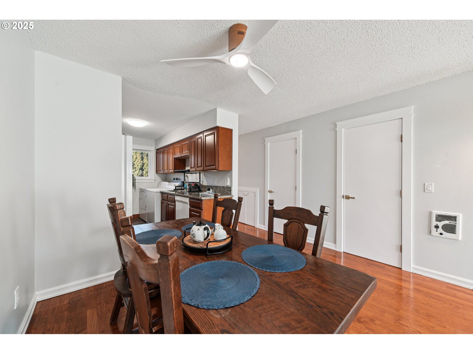 1302 Northeast Hogan Drive, Unit 169 Gresham, OR 97030 - Photo 8 of 46 a view of a dining room with furniture and wooden floor