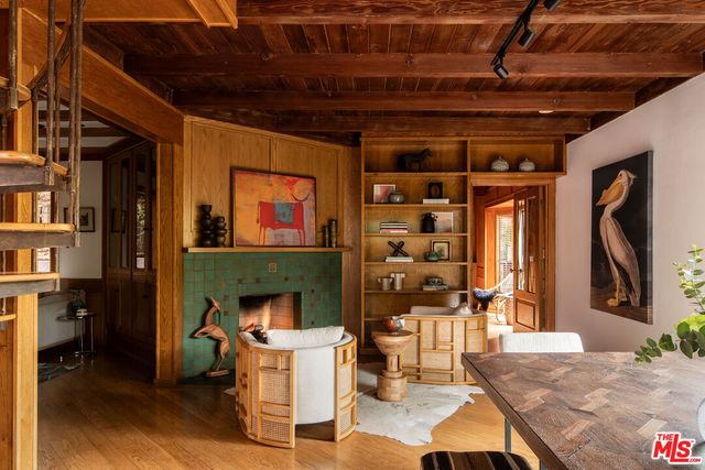 a front view of a house with outdoor seating