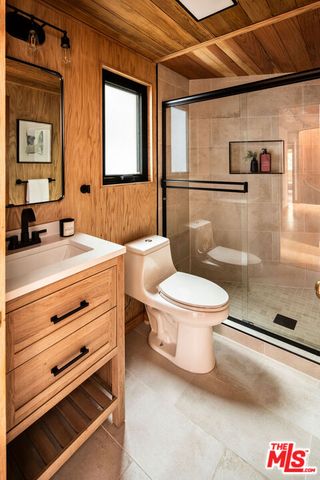 a bedroom with a bed and a chair