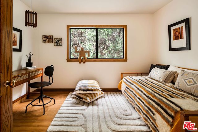 a bathroom with a shower curtain and a window