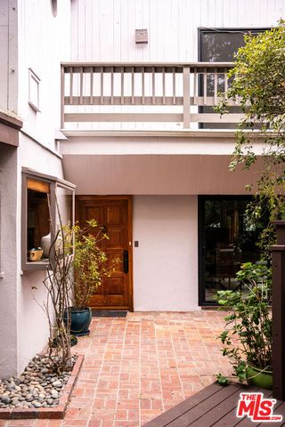 a outdoor living space with furniture and potted plants