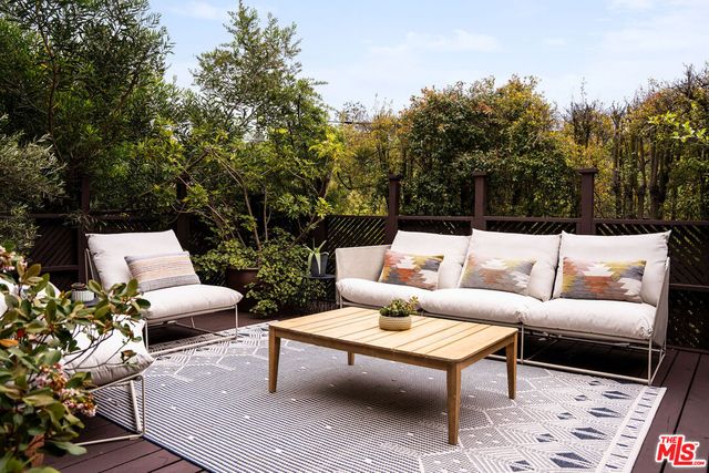 a view of a backyard with furniture