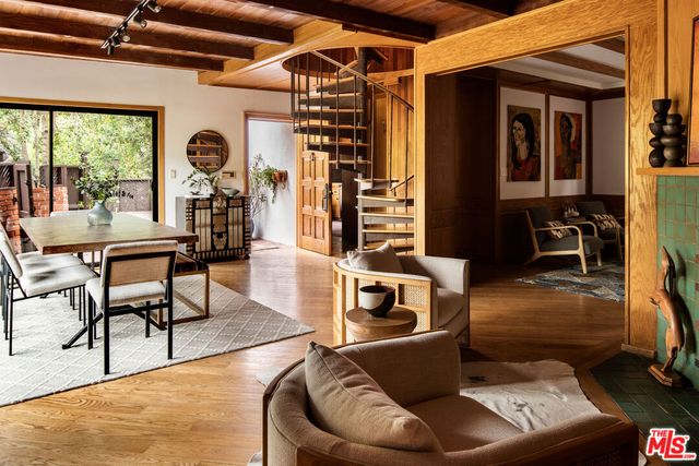 a work room with furniture and a large window