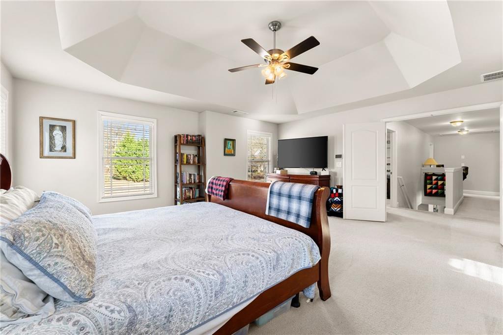 725 Larry Lane Winder, GA 30680 - Photo 28 of 62 a bedroom with a bed and a flat screen tv