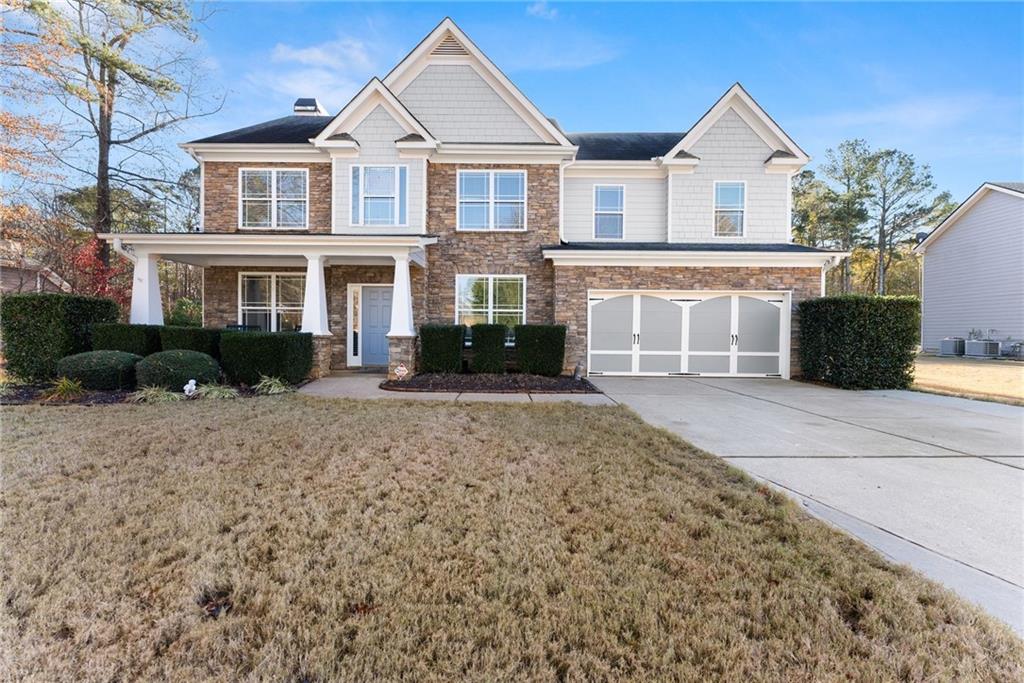 725 Larry Lane Winder, GA 30680 - Photo 3 of 62 a front view of a house with a yard