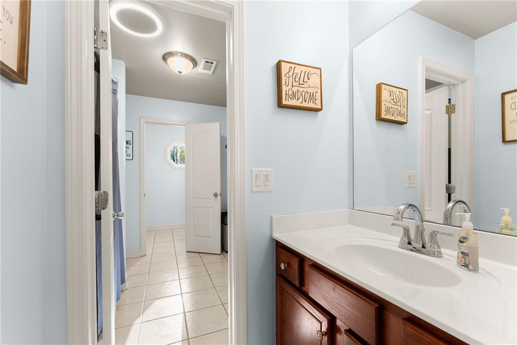 725 Larry Lane Winder, GA 30680 - Photo 43 of 62 a bathroom with a sink and a mirror