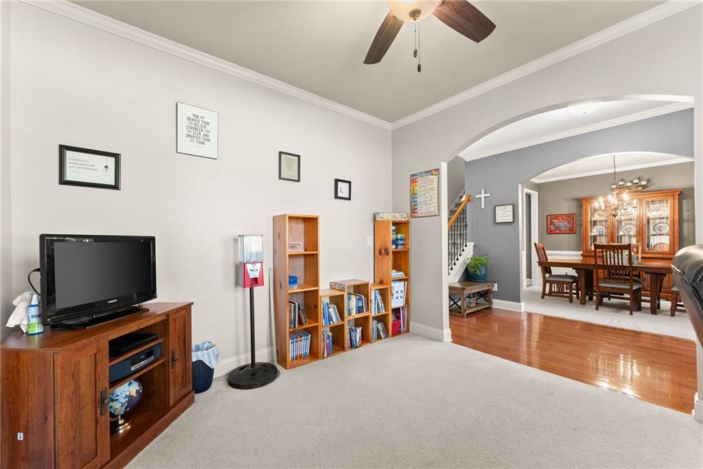 725 Larry Lane Winder, GA 30680 - Photo 9 of 62 a living room with furniture and a flat screen tv