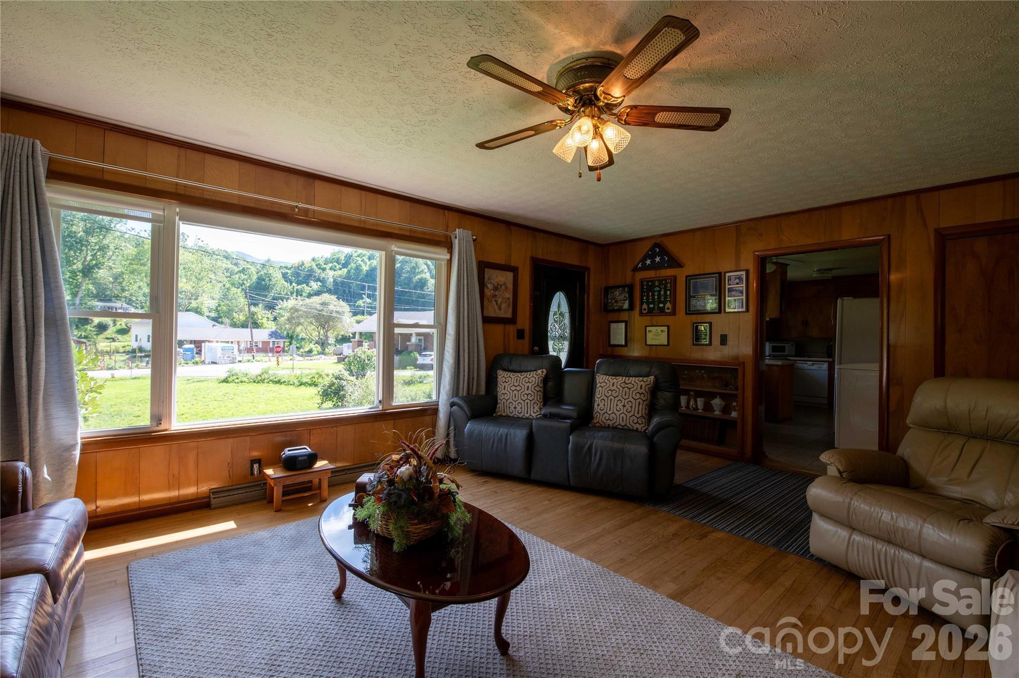 40 Double Island Road Burnsville, NC 28714 - Photo 7 of 38 a living room with furniture and a large window
