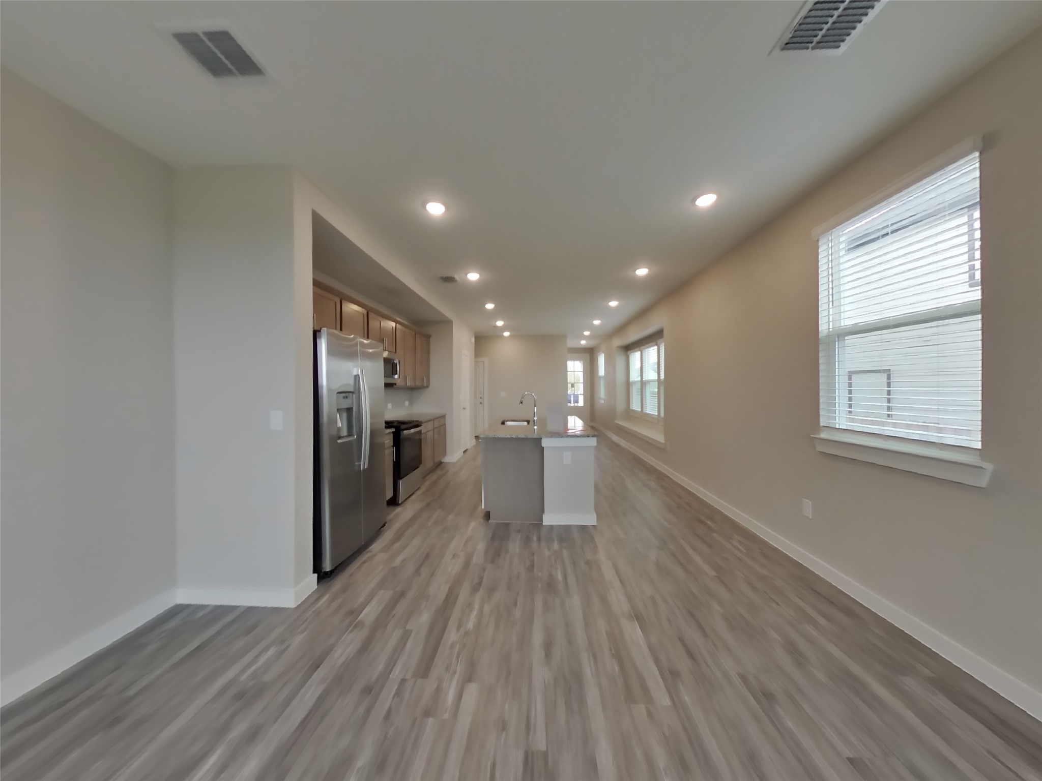 509 Raglands Road Leander, TX 78641 - Photo 17 of 18 a view of a hallway with wooden floor