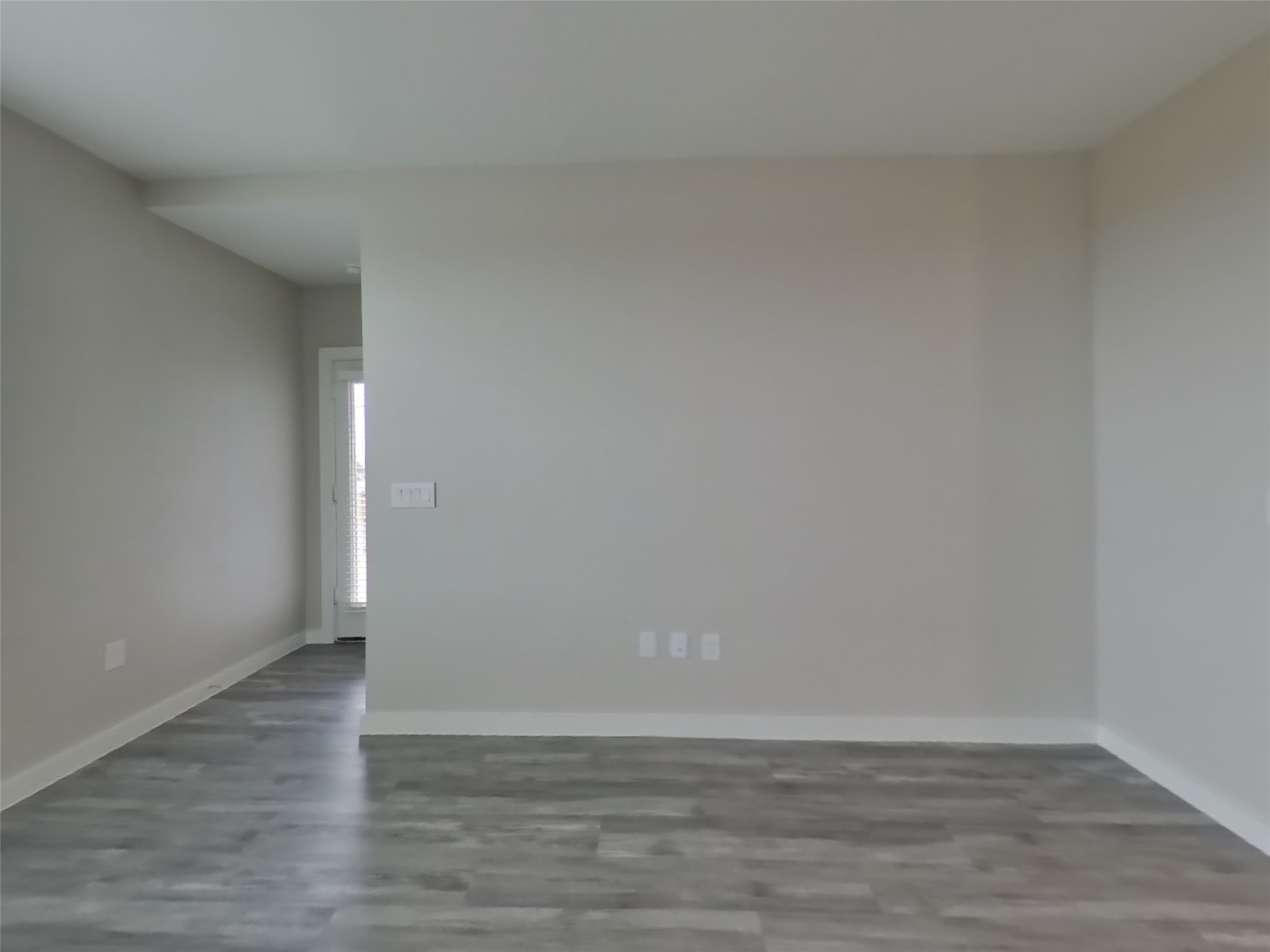 509 Raglands Road Leander, TX 78641 - Photo 2 of 18 a view of an empty room and wooden floor