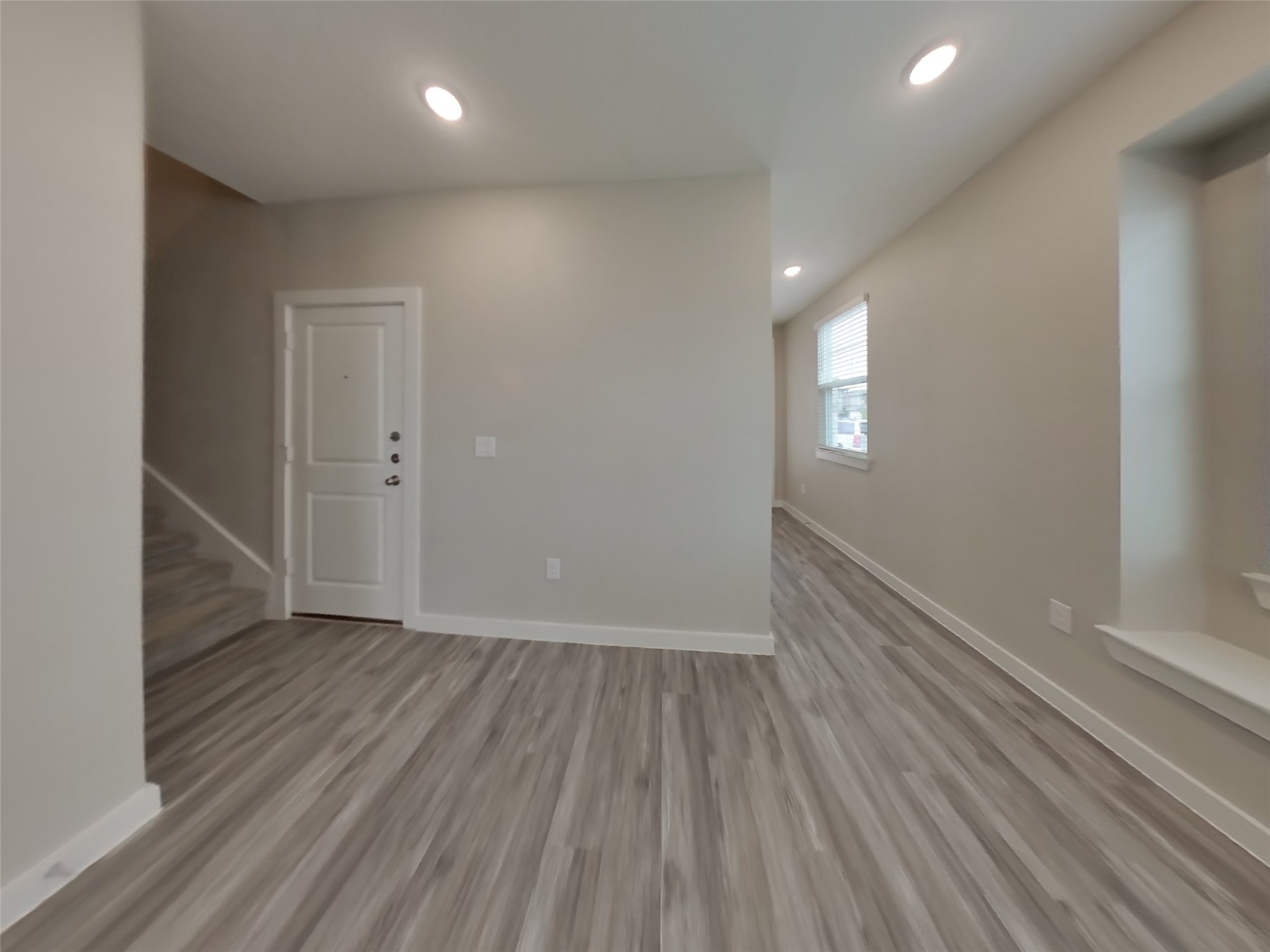 509 Raglands Road Leander, TX 78641 - Photo 3 of 18 wooden floor in an empty room with a window