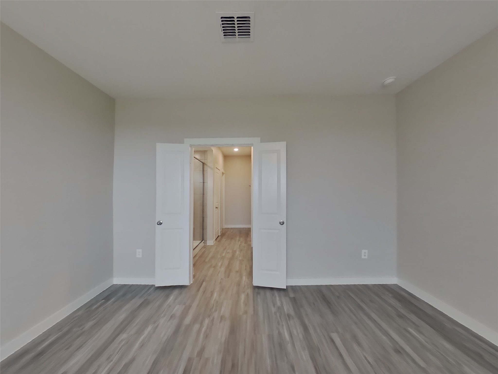 509 Raglands Road Leander, TX 78641 - Photo 5 of 18 a view of wooden floor and windows in a room