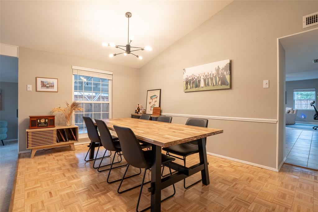 3124 Barton Road Carrollton, TX 75007 - Photo 11 of 36 a view of a dining room with furniture window and wooden floor