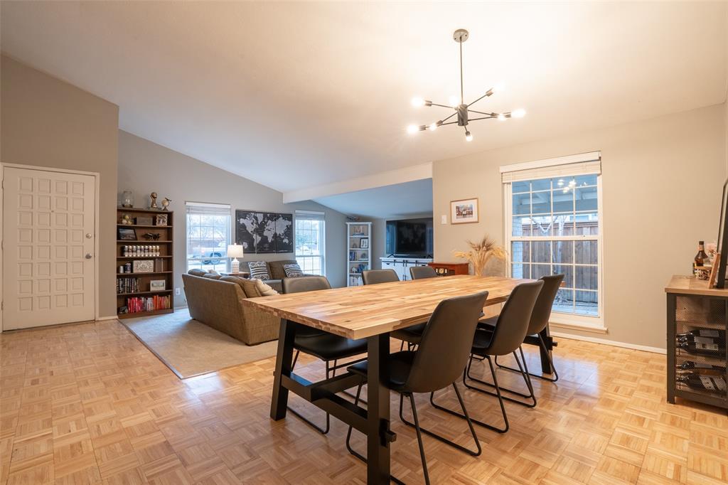 3124 Barton Road Carrollton, TX 75007 - Photo 12 of 36 a view of a dining room with furniture and a chandelier