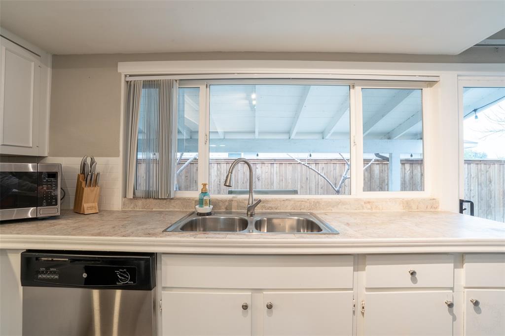 3124 Barton Road Carrollton, TX 75007 - Photo 23 of 36 a kitchen with a sink and a large window