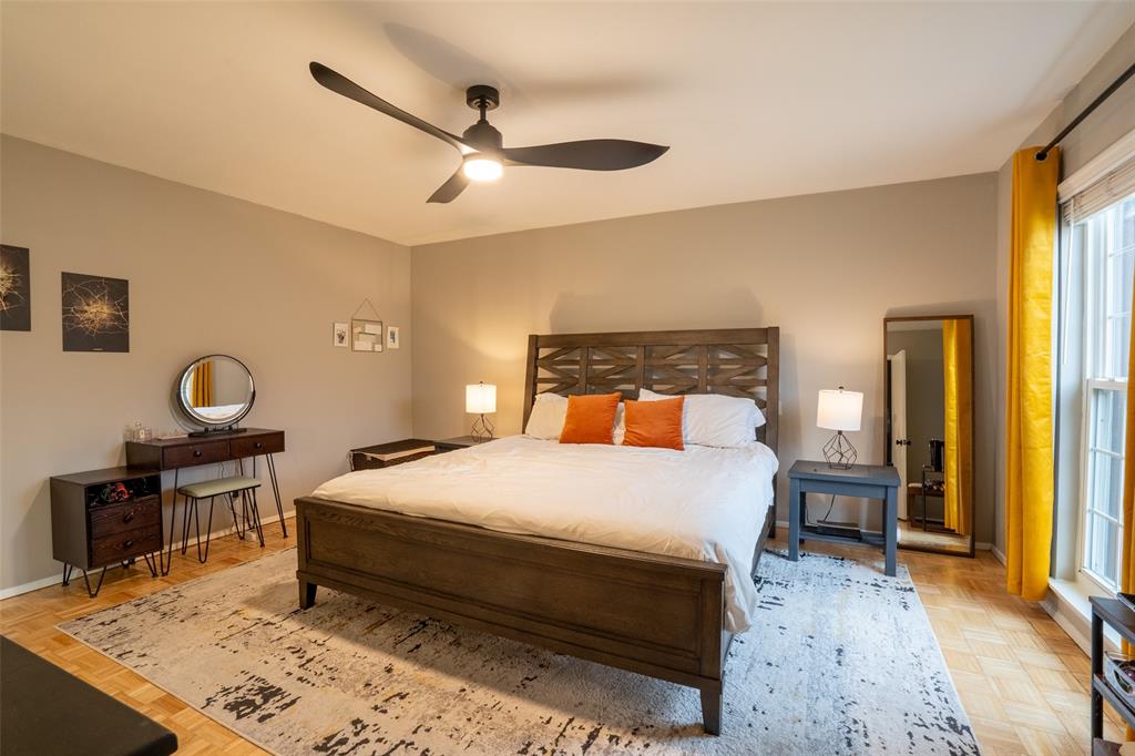 3124 Barton Road Carrollton, TX 75007 - Photo 28 of 36 a bedroom with a bed and a chandelier