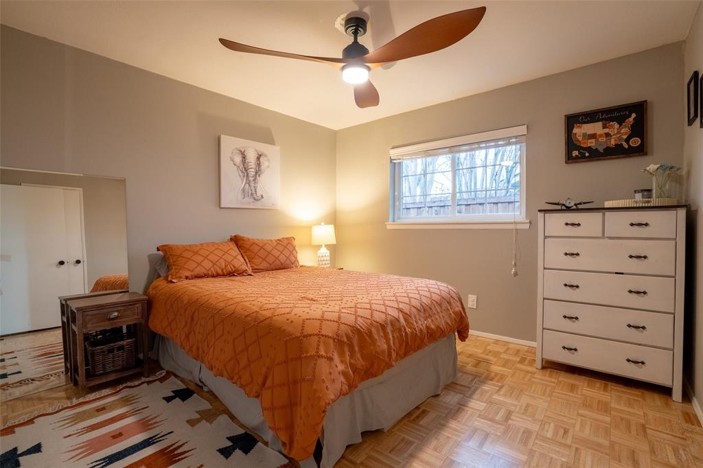3124 Barton Road Carrollton, TX 75007 - Photo 31 of 36 a bedroom with a bed a dresser and a window